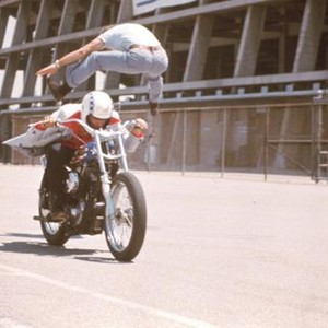 VIVA KNIEVEL!, Marjoe Gortner (top), Evel Knievel (on motorcycle), 1977
