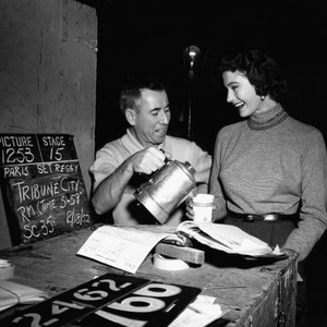 ASSIGNMENT: PARIS, Marta Toren, right, gets coffee from prop man Reggie Smith, on-set, February 18, 1952