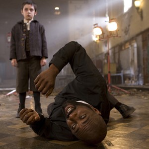 (L-R) Ethan Cutkosky as Barto and Idris Elba as Father Wyndham in "The Unborn." photo 19