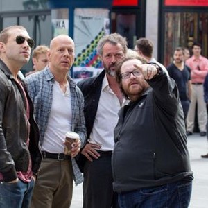 A GOOD DAY TO DIE HARD, from left: Jai Courtney, Bruce Willis, Sebastian Koch, director John Moore, on set, 2013. ph: Frank Masi/TM & copyright ©20th Century Fox Film Corp. All rights reserved