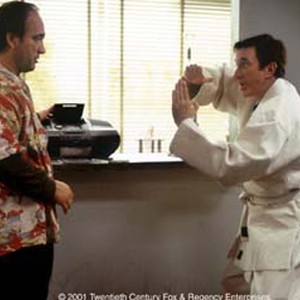 Joe Scheffer (TIM ALLEN, right ) demonstrates some bizarre moves to his disbelieving karate instructor, Chuck Scarett (JIM BELUSHI).
