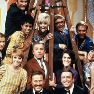 Dick Whittington (top row); Chelsea Brown, Goldie Hawn, Arte Johnson and Alan Sues (second row, from left); Dave Madden, Judy Carne, Henry Gibson, Ruth Buzzi and Jo Anne Worley (third row, from left); Dan Rowan (left) and Dick Martin (bottom row)