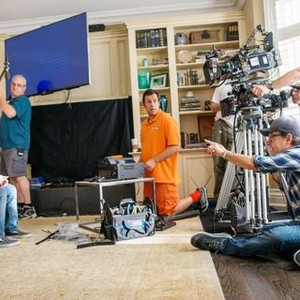 PIXELS, Matt Lintz (left), Adam Sandler (orange), director Chris Columbus (pointing), on set, 2015. ph: George Kraychyk/©Columbia Pictures