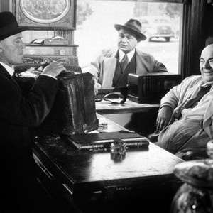 THE STRANGER, from left: Konstantin Shayne, Edward G. Robinson (looking in window), Billy House, 1946