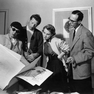 KNOCK ON WOOD, Edith Head shows costume design sketches to Danny Kaye, Mai Zetterling, director Norman Panama, 1954