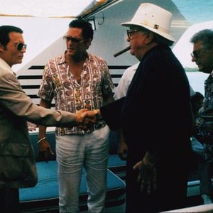 DONNIE BRASCO, shaking hands from left: Johnny Depp, Robert Miano, Michael Madsen (center), 1997, © TriStar