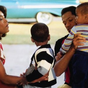 WHAT'S LOVE GOT TO DO WITH IT, Angela Bassett (left), Laurence Fishburne (holding child), 1993, © Buena Vista