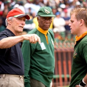 INVICTUS, from left: director Clint Eastwood, Morgan Freeman as Nelson Mandela, Matt Damon, on set, 2009. ©Warner Bros.