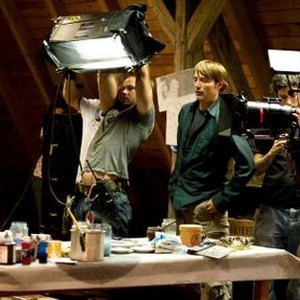 THE DOOR, (aka DIE TUR), Jessica Schwarz (left), Mads Mikkelsen (right of center), on set, 2009. ©Senator Film