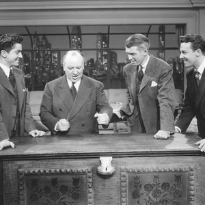 ROPE, from left: Farley Granger, director Alfred Hitchcock, James Stewart, John Dall on set, 1948