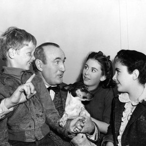 NATIONAL VELVET, Donald Crisp entertains child stars Jackie 'Butch' Jenkins, Juanita Quigley, Elizabeth Taylor, on-set, 1944