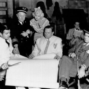 CHINA SEAS, from left, Clark Gable, Dudley Digges, Jean Harlow, Wallace Beery, director Tay Garnett, on-set, 1935