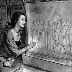 DEPORTED, Marta Toren, on location in Pompeii, studies excavation, 1950