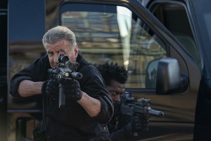 Rook (Sylvester Stallone, L) and an uncredited henchman, in "Armor." (Lionsgate Films)