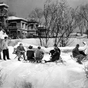 H.M. PULHAM, ESQ., director King Vidor, (seated, left), and cast prepare for snowball fight, on-set, 1941