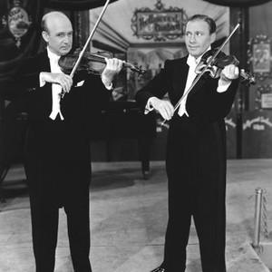 HOLLYWOOD CANTEEN, from left: Joseph Szigeti, Jack Benny, 1944