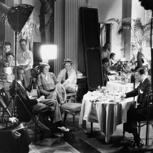 IF I WERE FREE, director Elliott Nugent (two tone shoes), Irene Dunne (seated under light), Clive Brook (right) filming on set, 1933