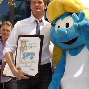 Neil Patrick Harris, Smurfette in attendance for THE SMURFS 2 Sponsors Global Smurfs Day, The Grove, Los Angeles, CA June 22, 2013. Photo By: Emiley Schweich/Everett Collection