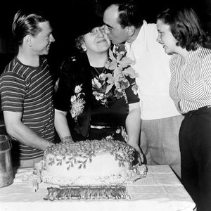 STRIKE UP THE BAND, Mickey Rooney and Judy Garland look on as director Busby Berkeley kisses Mickey's mother Mrs. Nell Pankey on set, 1940