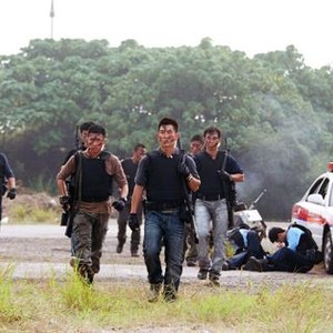 THE SNIPER, (aka SUN CHEUNG SAU, aka GODLY GUNSLINGERS), foreground from left: Wilfred LAU (striped shirt), Richie REN (blue jeans), 2009. ©Media Asia