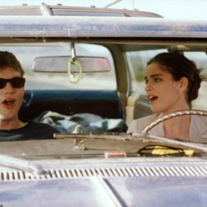 (L-R) Ashton Kutcher as Oliver Martin and Amanda Peet as Emily Friehl in "A Lot Like Love." photo 11
