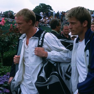 (L to r) Peter Colt (PAUL BETTANY) and practice partner Dieter Proll (NIKOLAJ COSTER-WALDAU) take in the Wimbledon crowds in Working Title Films' romantic comedy Wimbledon. photo 5