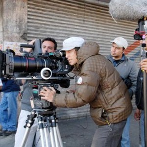 SIN NOMBRE, director Cary Fukunaga (right of camera), on set, 2009. ©Focus Features