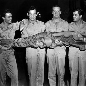 CULT OF THE COBRA, James Dobson, William Reynolds, David Janssen, Marshall Thompson, Richard Long holding cult dancer Carlsson on set, 1955