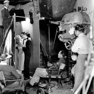 RED-HEADED WOMAN, Jean Harlow, Chester Morris, director Jack Conway filming a scene, 1932