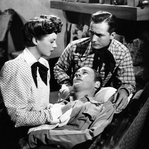 SUNSET PASS, from left, Nan Leslie, James Warren, (lying down), Robert Clarke, 1946