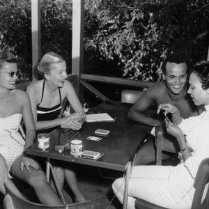 ISLAND IN THE SUN,  Patricia Owens, Joan Fontaine, Harry Belafonte, Dorothy Dandridge, playing cards between takes, 1957, TM and (c)  20th Century Fox.