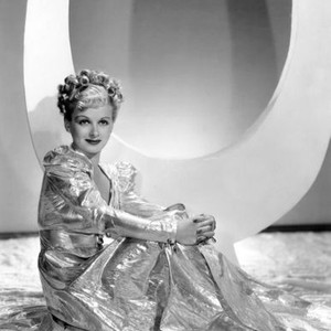 ARTISTS AND MODELS ABROAD, Joan Bennett wearing gold lame negligee designed by Edith Head, 1938