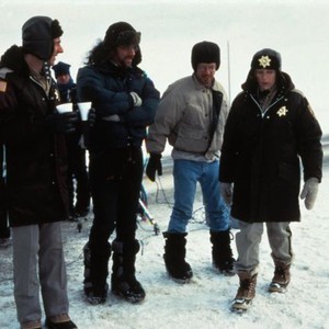 FARGO, director Joel Coen (arms folded), Ethan Coen, Frances McDormand (in policewoman costume) on set, 1996, (c) Gramercy Pictures