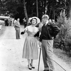 INTERLUDE, Jane Wyatt discussing a scene with director Douglas Sirk, on location, Nymphenburg Gardens, Munich, Germany, 1957
