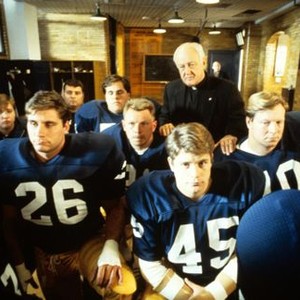 RUDY, Sean Astin (center right), Father James Riehle (back), 1993, ©TriStar Pictures