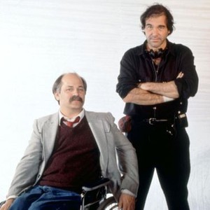 BORN ON THE FOURTH OF JULY, writer Ron Kovic, director Oliver Stone, on set, 1989. ©Universal