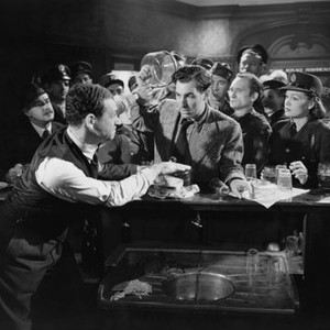 THE SMALL BACK ROOM, Sid James (hand on arm), David Farrar (holding bottle), Renee Asherson (front right), 1949
