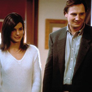Suffering from post-traumatic stress syndrome, undercover DEA agent Charlie Mayough (Liam Neeson, right) finds relief with Judy Tipp (Sandra Bullock, left). photo 15