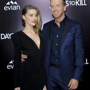 Amber Heard, McG at arrivals for 3 DAYS TO KILL Premiere, ArcLight Cinemas, Los Angeles, CA February 12, 2014. Photo By: Elizabeth Goodenough/Everett Collection
