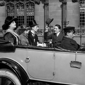 THE ROAD TO LONDON, in back seat, from left, Saba Raleigh, Joan Morgan, Gibb McLaughlin; tipping hat, Bryant Washburn; Miles Mander, (chauffeur),  1921