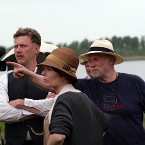 (L-R) Mikael Persbrandt, Maria Heiskanen, and Jan Troell on the set of "Everlasting Moments."