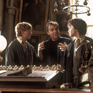 Director CHRIS COLUMBUS (center) on the set with DANIEL RADCLIFFE (right) and RUPERT GRINT in Warner Bros. Pictures' "Harry Potter and the Chamber of Secrets"