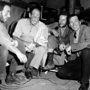 THE TREASURE OF THE SIERRA MADRE, from left: Humphrey Bogart, visitor Jack Holt, Tim Holt, director John Huston on set, 1948