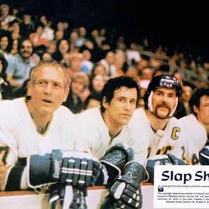 SLAP SHOT, in uniform from left: Paul Newman, Michael Ontkean, 1977