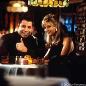 (Left to right) John Travolta as Russ Richards and Lisa Kudrow as Crystal Latroy.