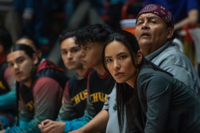 Heather Hobbs (Jessica Matten, foreground) is the boys' varsity basketball coach, in "Rez Ball." (Wise Entertainment/Netflix)