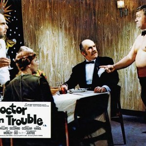 DOCTOR IN TROUBLE, Robert Morley (standing left), Harry Secombe (standing right), 1970