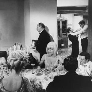 THE PARTY, Carol Wayne, Peter Sellers, and Steve Franken (as the butler being choked by the waiter in the back), 1968
