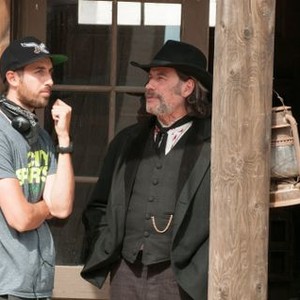 IN A VALLEY OF VIOLENCE, FROM LEFT: DIRECTOR TI WEST, JOHN TRAVOLTA, ON SET, 2016. PH: URSULA COYOTE/© FOCUS FEATURES