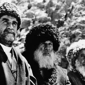 MEETINGS WITH REMARKABLE MEN, Warren Mitchell, (left), Afghan tribesmen, 1979